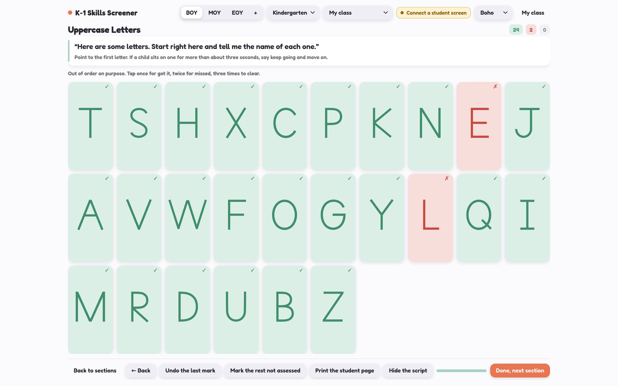 The teacher's marking screen for uppercase letters, with the script in quotes at the top and the letters laid out large